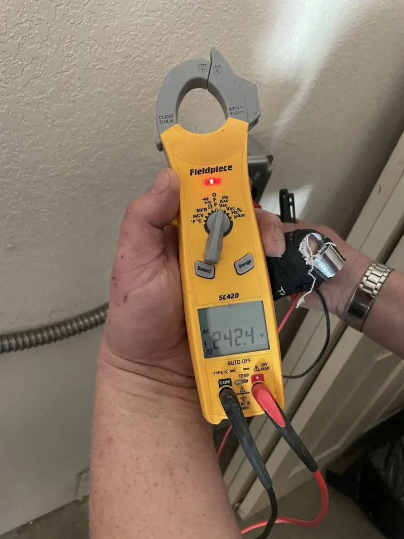 Voltage testing with clamp meter during Electrical Installation Services in Indianola